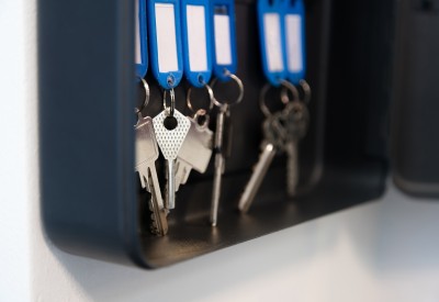 Hanging keys in metal cabinet for safety office or household keys management and keeping. keys with blank name tags, space for text